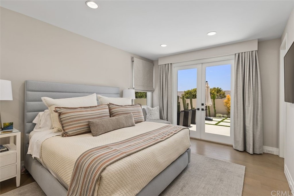846 Emerald Bay Laguna Beach, CA 92651 - Photo 36 of 42 a bedroom with a balcony a bed and glass door