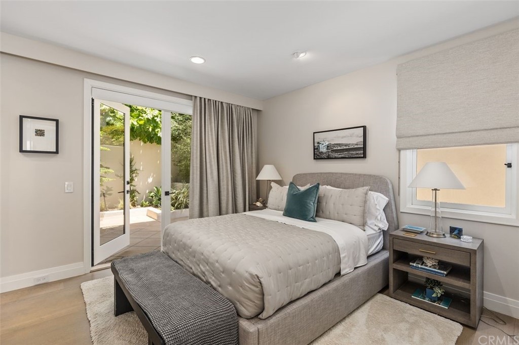 846 Emerald Bay Laguna Beach, CA 92651 - Photo 38 of 42 a bedroom with a bed and a large window