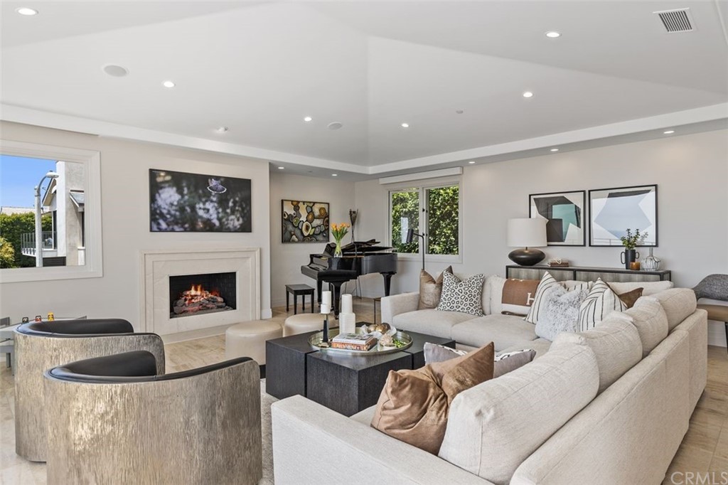 846 Emerald Bay Laguna Beach, CA 92651 - Photo 8 of 42 a living room with furniture and a fireplace