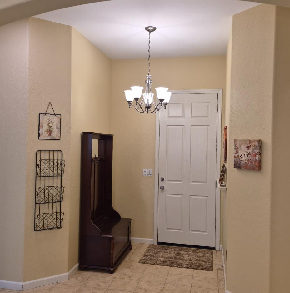 1845 Indiana Street Gridley, CA 95948 - Photo 3 of 12 a living room with furniture and a chandelier