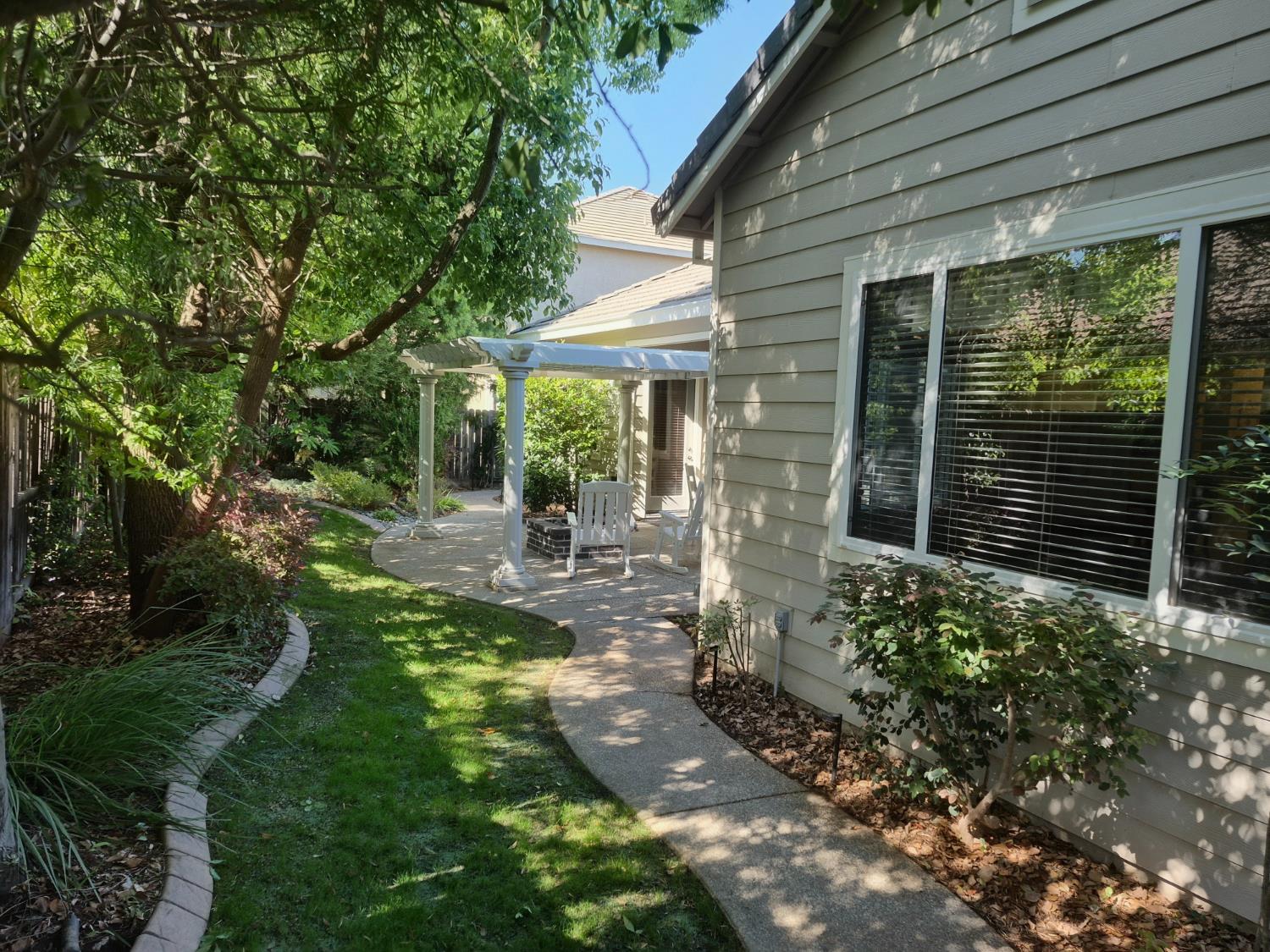 1845 Indiana Street Gridley, CA 95948 - Photo 10 of 12 a front view of a house with garden