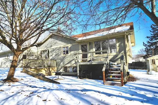 a view of a house with a snow on the road