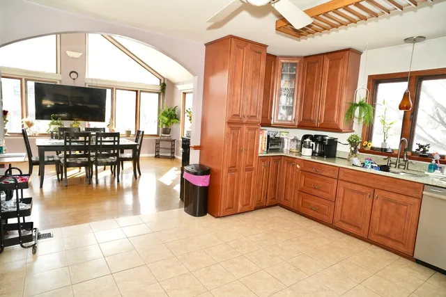 a kitchen with lots of counter top space and dining table