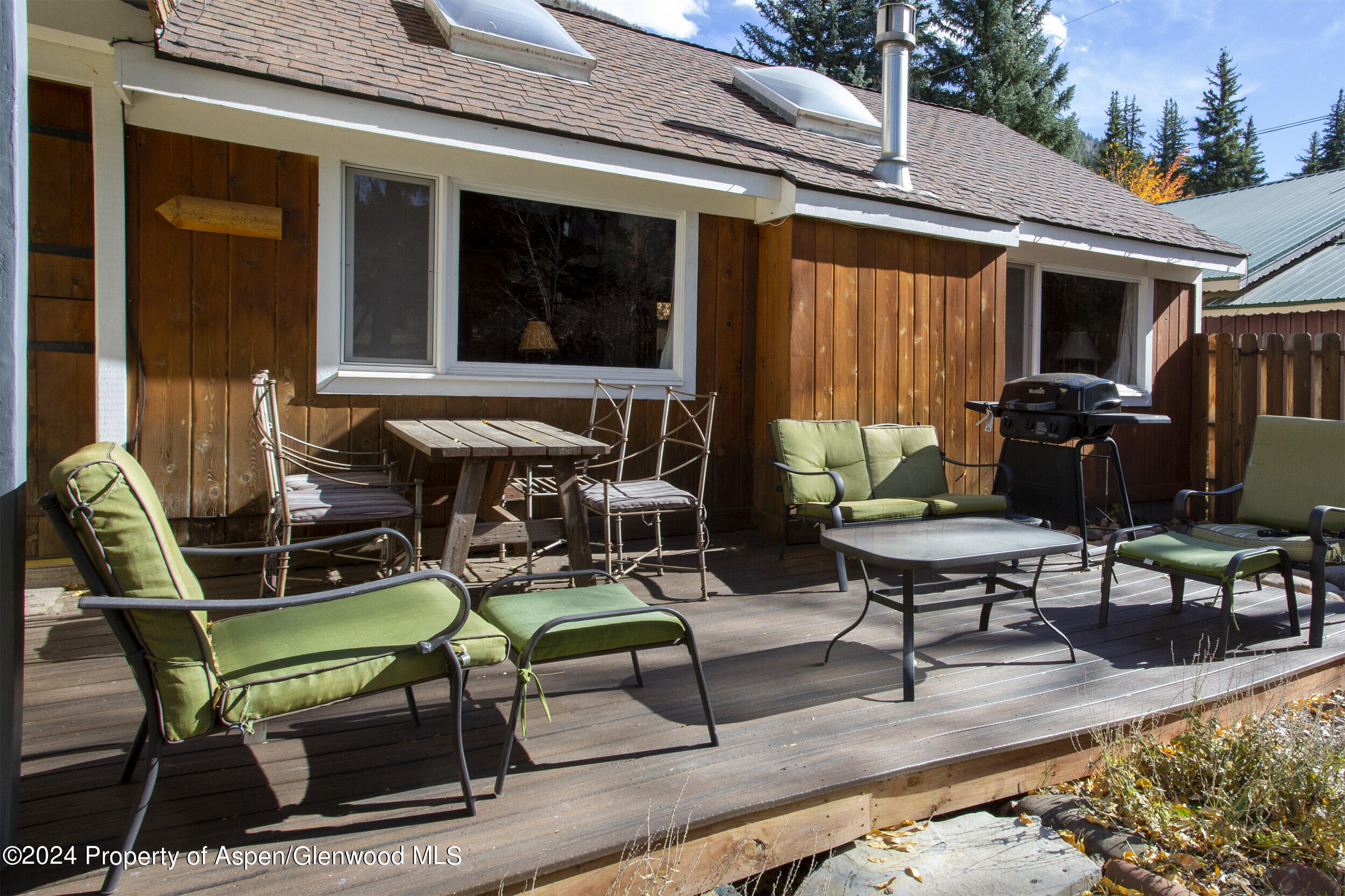 385 Redstone Boulevard Redstone, CO 81623 - Photo 16 of 20 a backyard of a house with outdoor seating