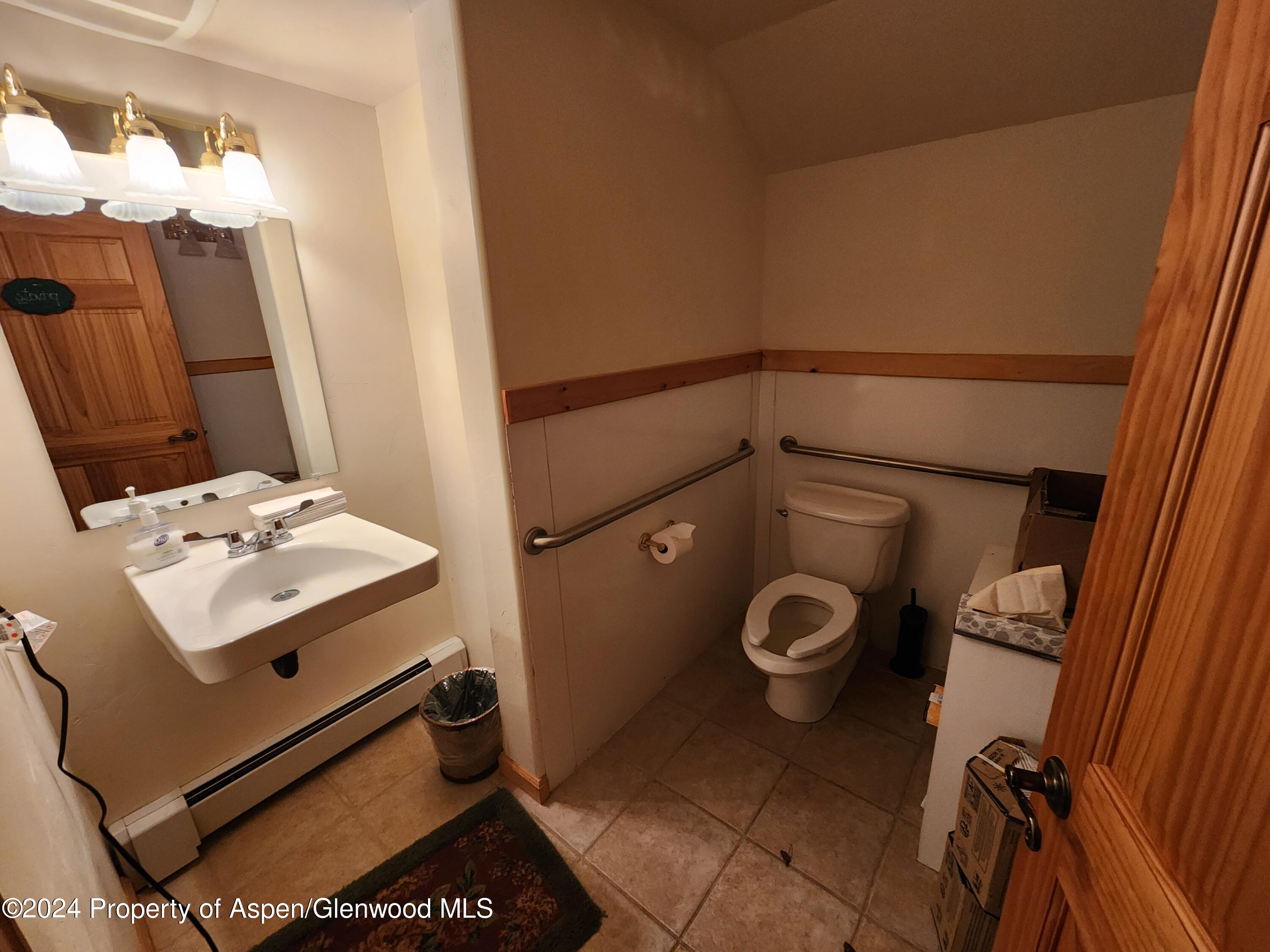 385 Redstone Boulevard Redstone, CO 81623 - Photo 20 of 20 a bathroom with a toilet sink and mirror