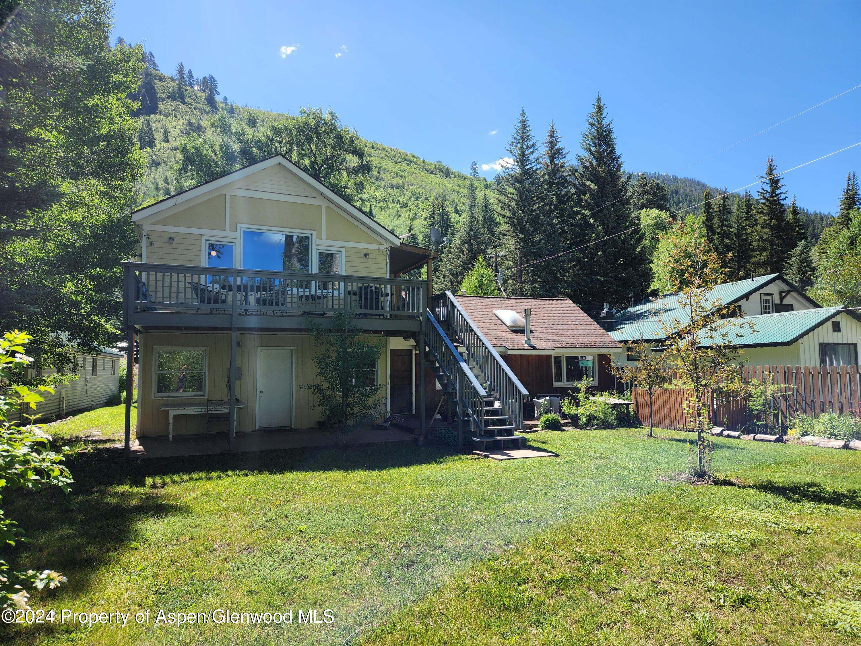 385 Redstone Boulevard Redstone, CO 81623 - Photo 7 of 20 a front view of a house with a yard