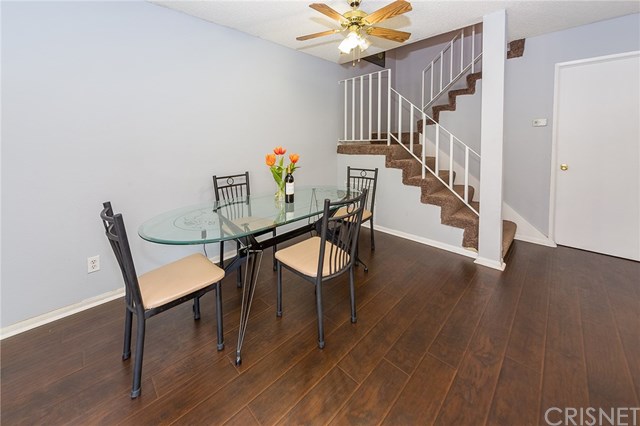 Dining room with fresh paint and new laminate flooring. New carpet on the stairs and entire second floor.