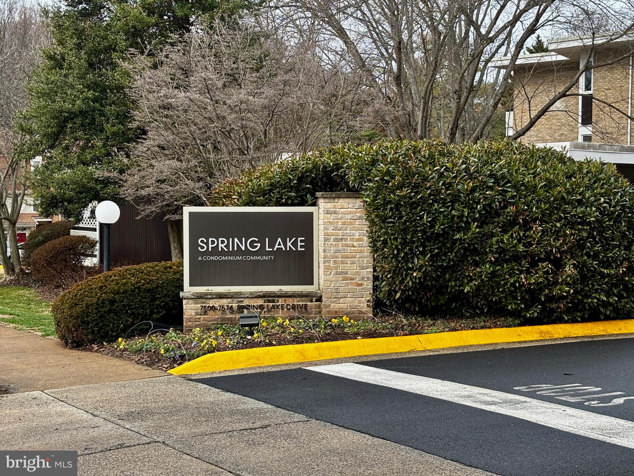 7548 Spring Lake Drive, Unit A Bethesda, MD 20817 - Photo 18 of 23 a view of swimming pool with an outdoor seating area and trees around