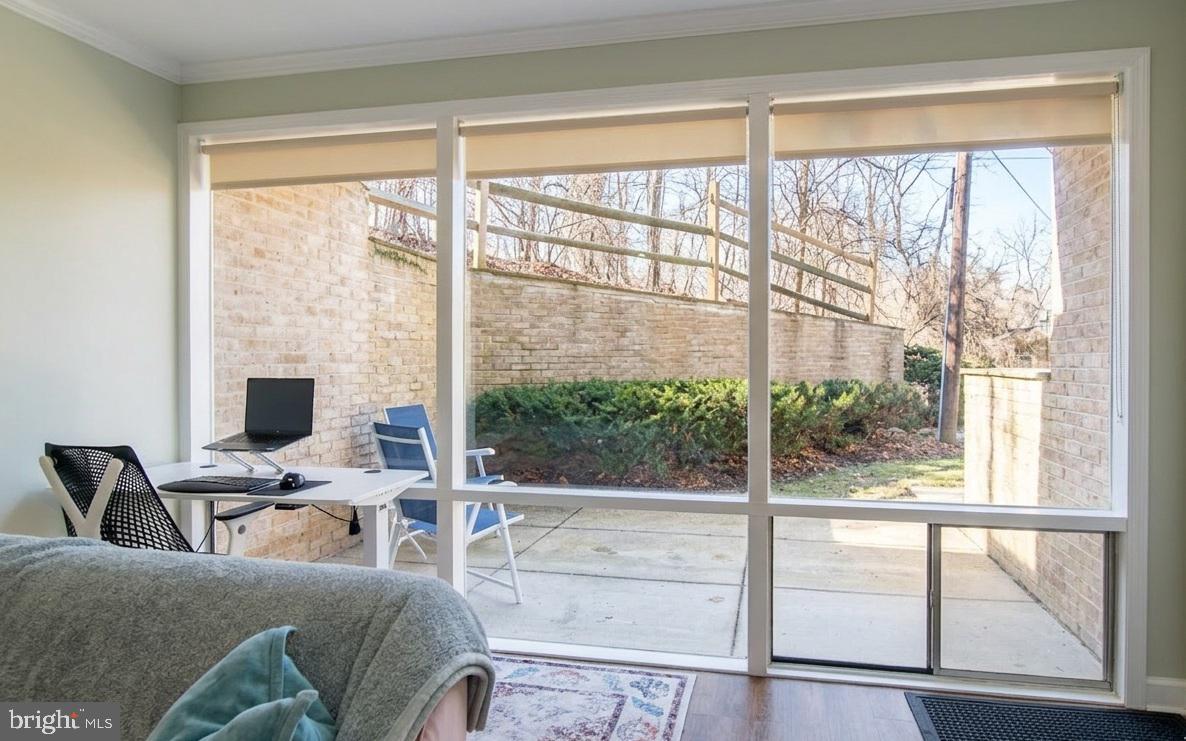 7548 Spring Lake Drive, Unit A Bethesda, MD 20817 - Photo 3 of 23 a view of a livingroom with workspace and a large window