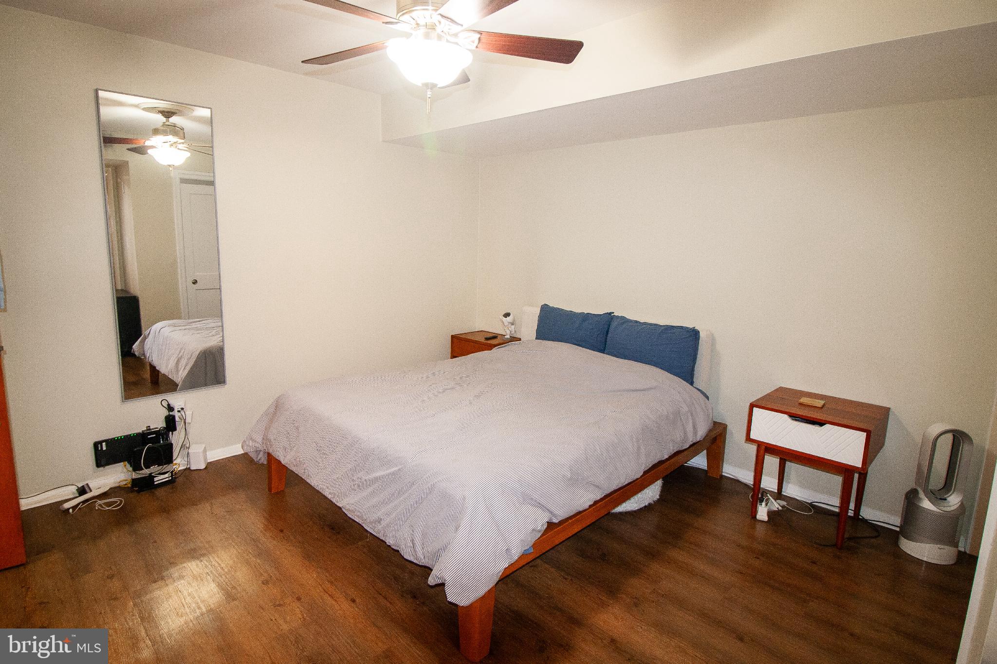 7548 Spring Lake Drive, Unit A Bethesda, MD 20817 - Photo 10 of 23 a bedroom with bed and a chair