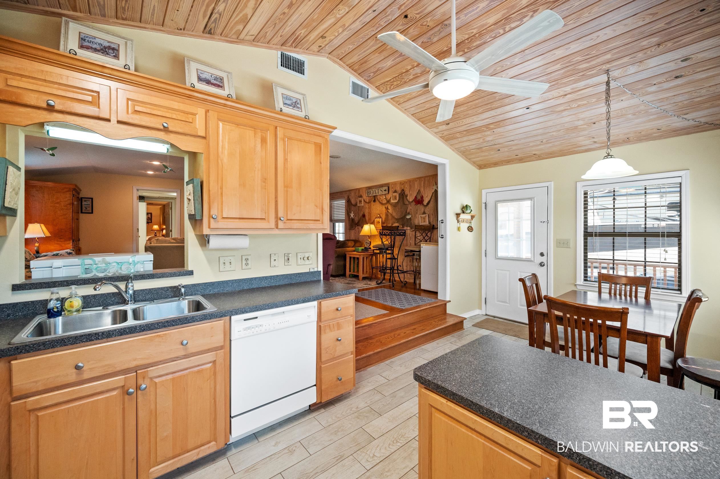 5392 Ornacor Avenue Orange Beach, AL 36561 - Photo 12 of 48 Kitchen with wood ceiling, decorative light fixtures, sink, and white dishwasher
