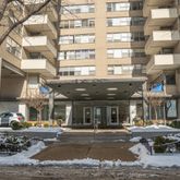 a front view of a building with street view