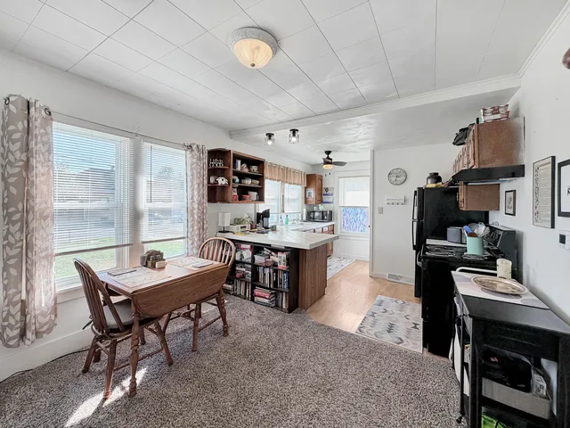 a workspace with furniture and a window