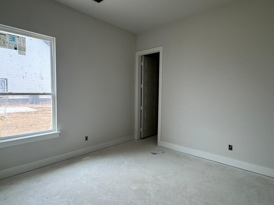 2305 Quartz Street Krum, TX 76249 - Photo 14 of 18 an empty room with a window