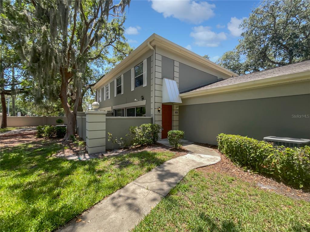 6241 Dewdrop Way Temple Terrace, FL 33617 - Photo 1 of 1 a front view of a house with a yard