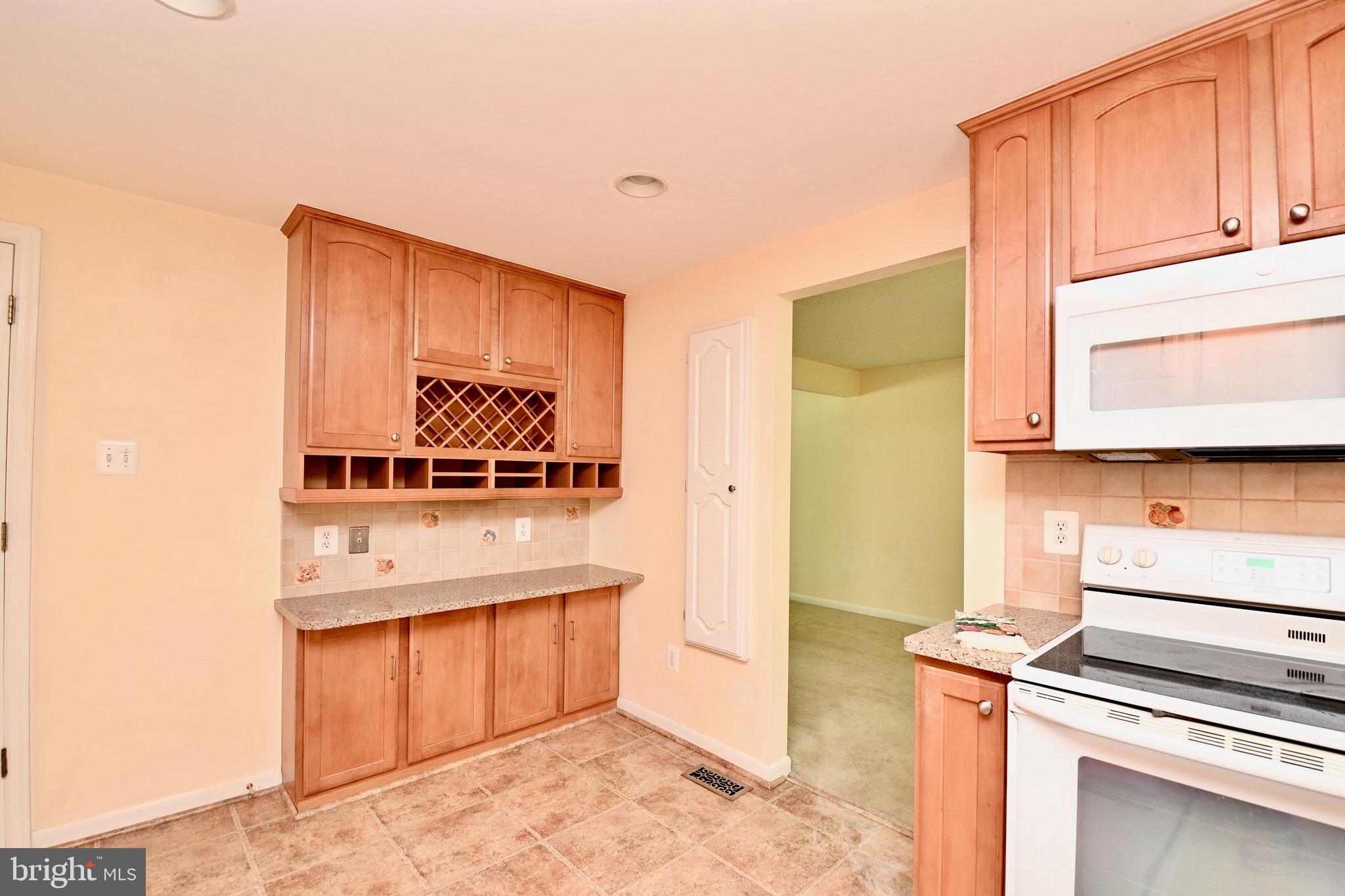 8113 Winter Blue Court Springfield, VA 22153 - Photo 15 of 58 Built-in ironing board on wall