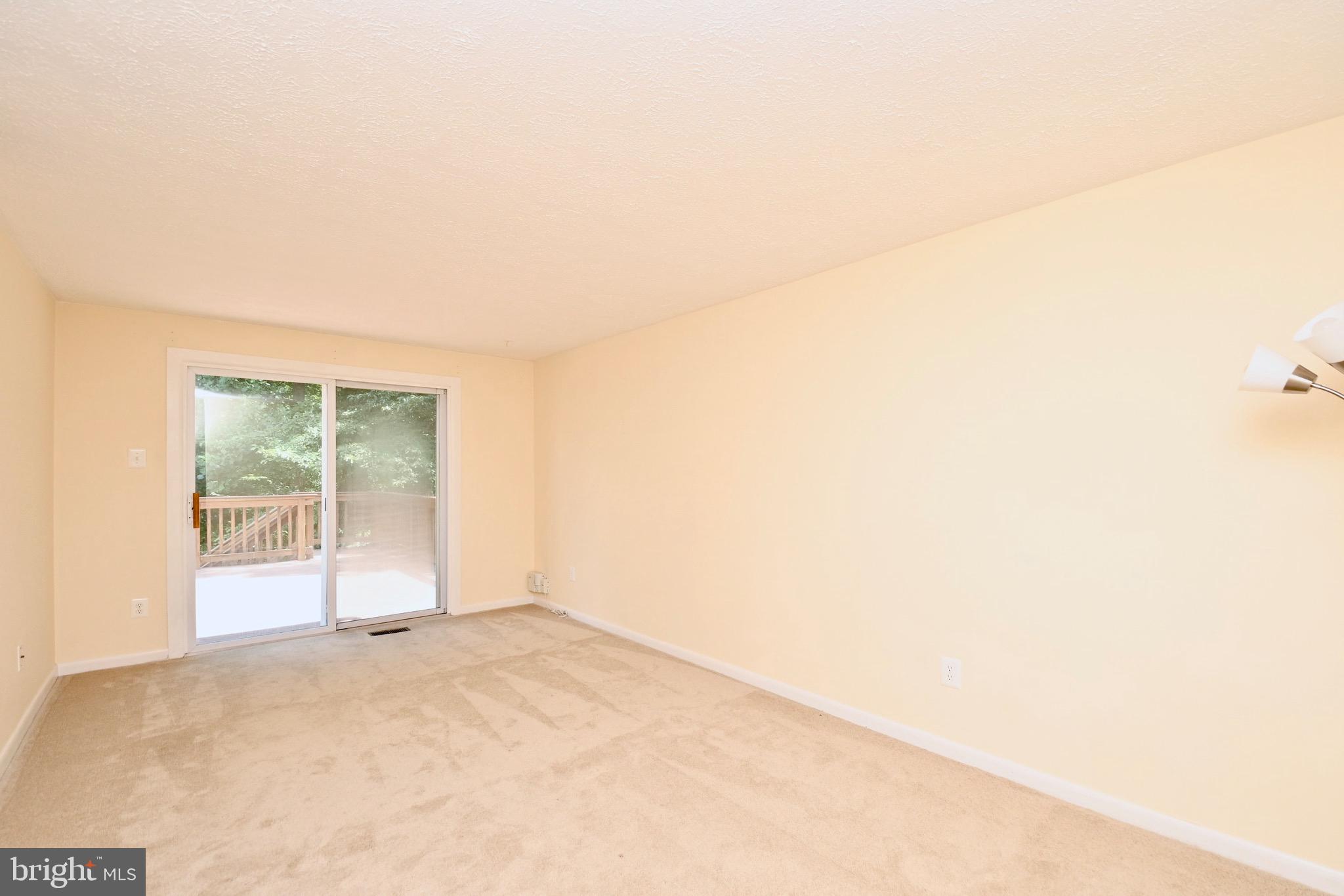 8113 Winter Blue Court Springfield, VA 22153 - Photo 18 of 58 Family room leading to over sized deck