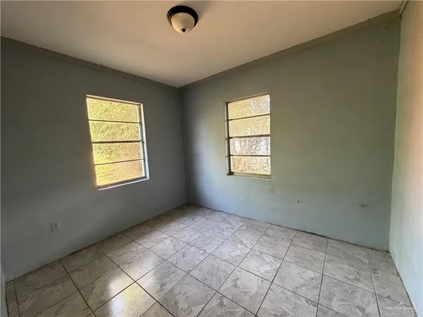 an empty room with windows