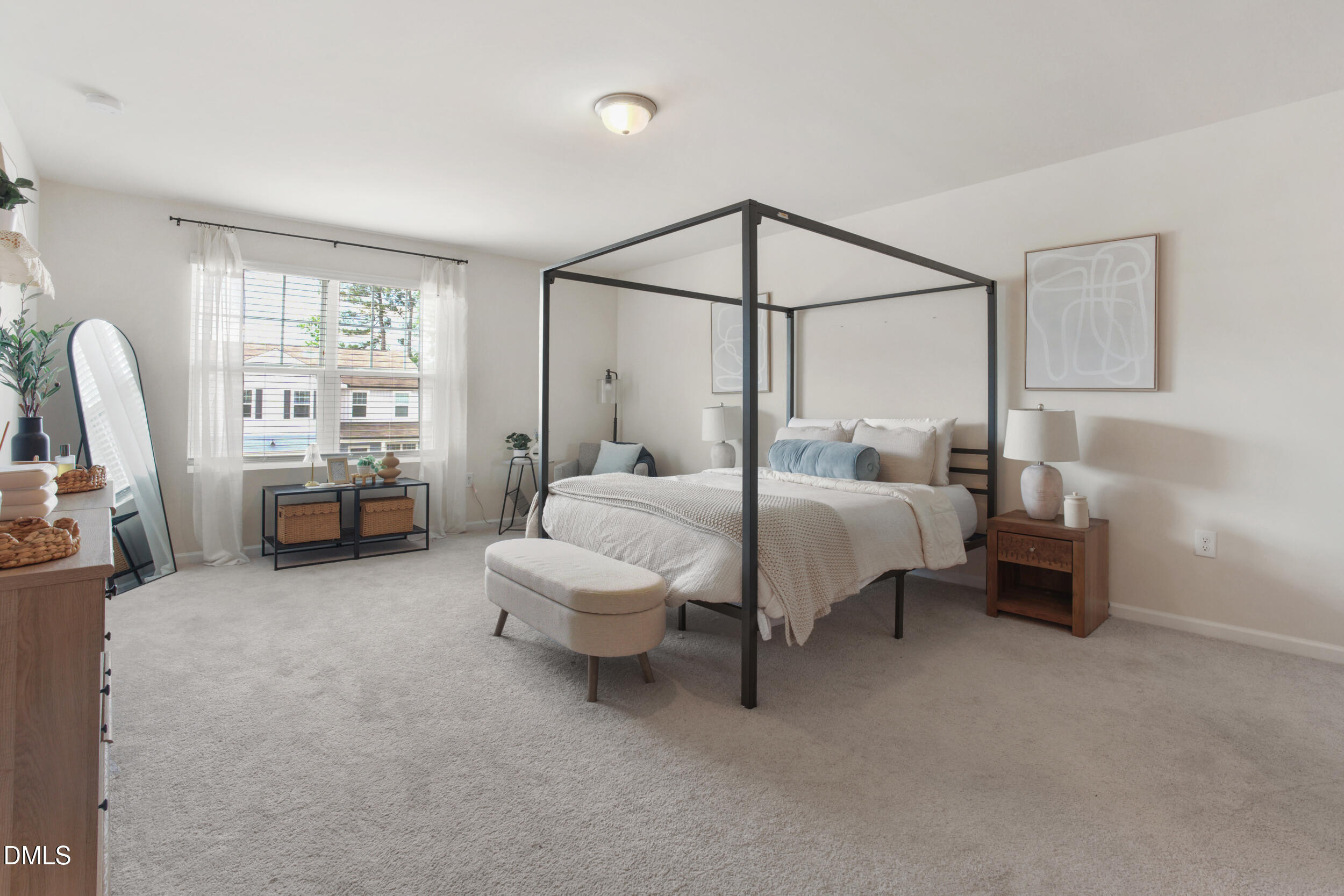 1416 Heron Pond Street Raleigh, NC 27604 - Photo 16 of 25 a bedroom with bed and a chandelier