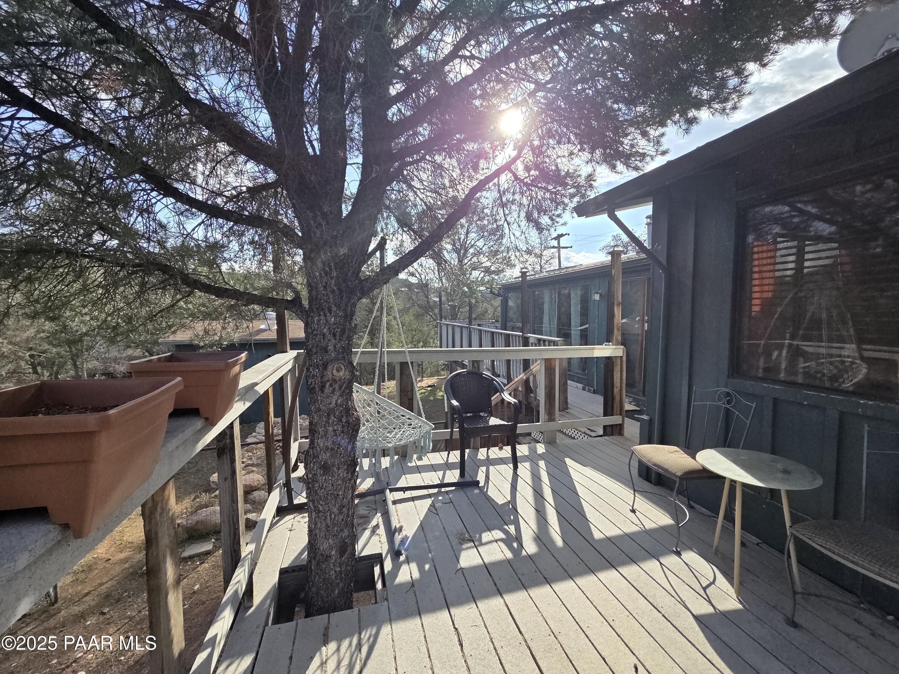 7250 West Hootenanny Road Prescott, AZ 86305 - Photo 14 of 30 a view of a chairs and table on the wooden floor