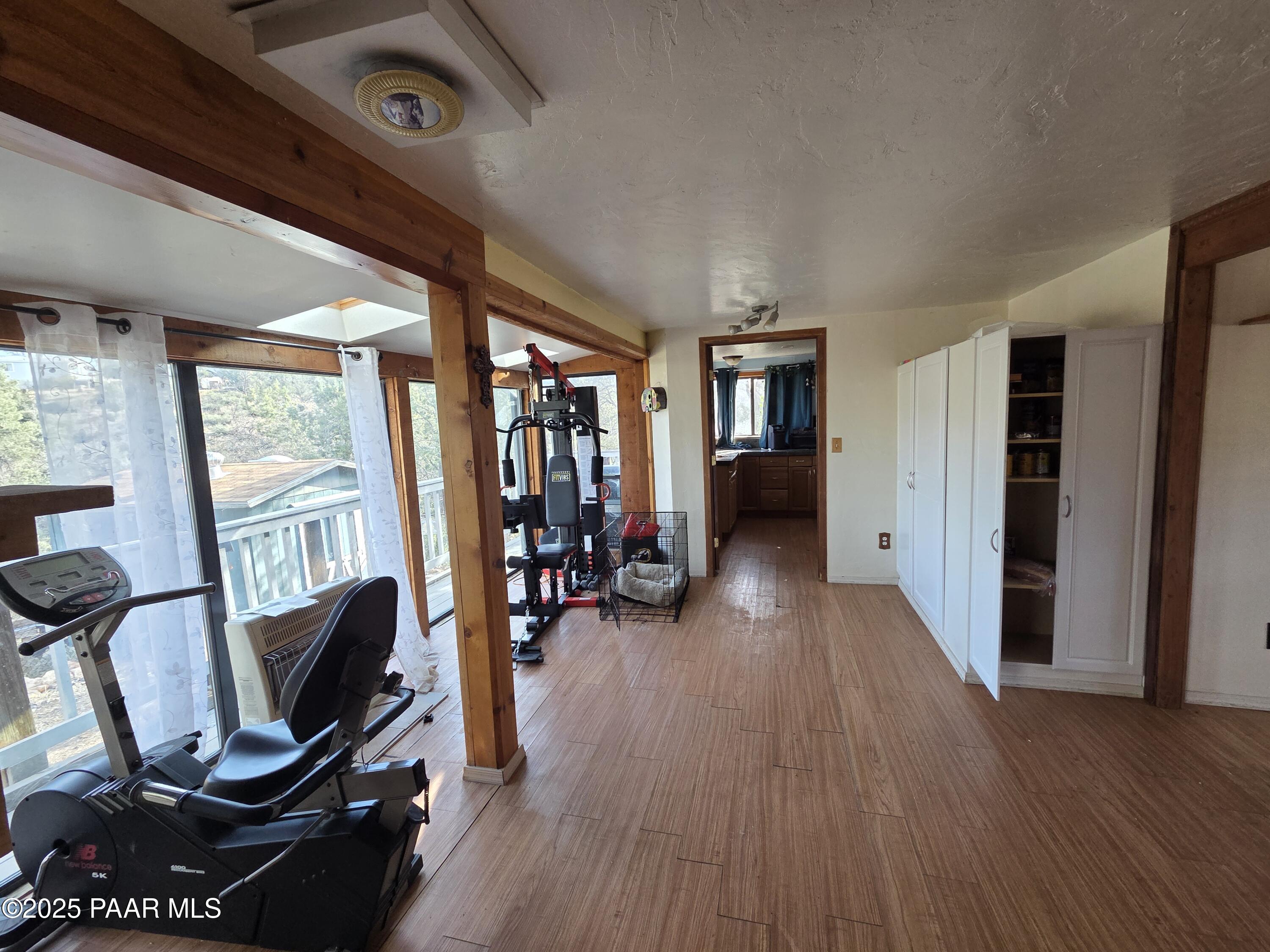 7250 West Hootenanny Road Prescott, AZ 86305 - Photo 19 of 30 a view of a livingroom with furniture and hardwood floor