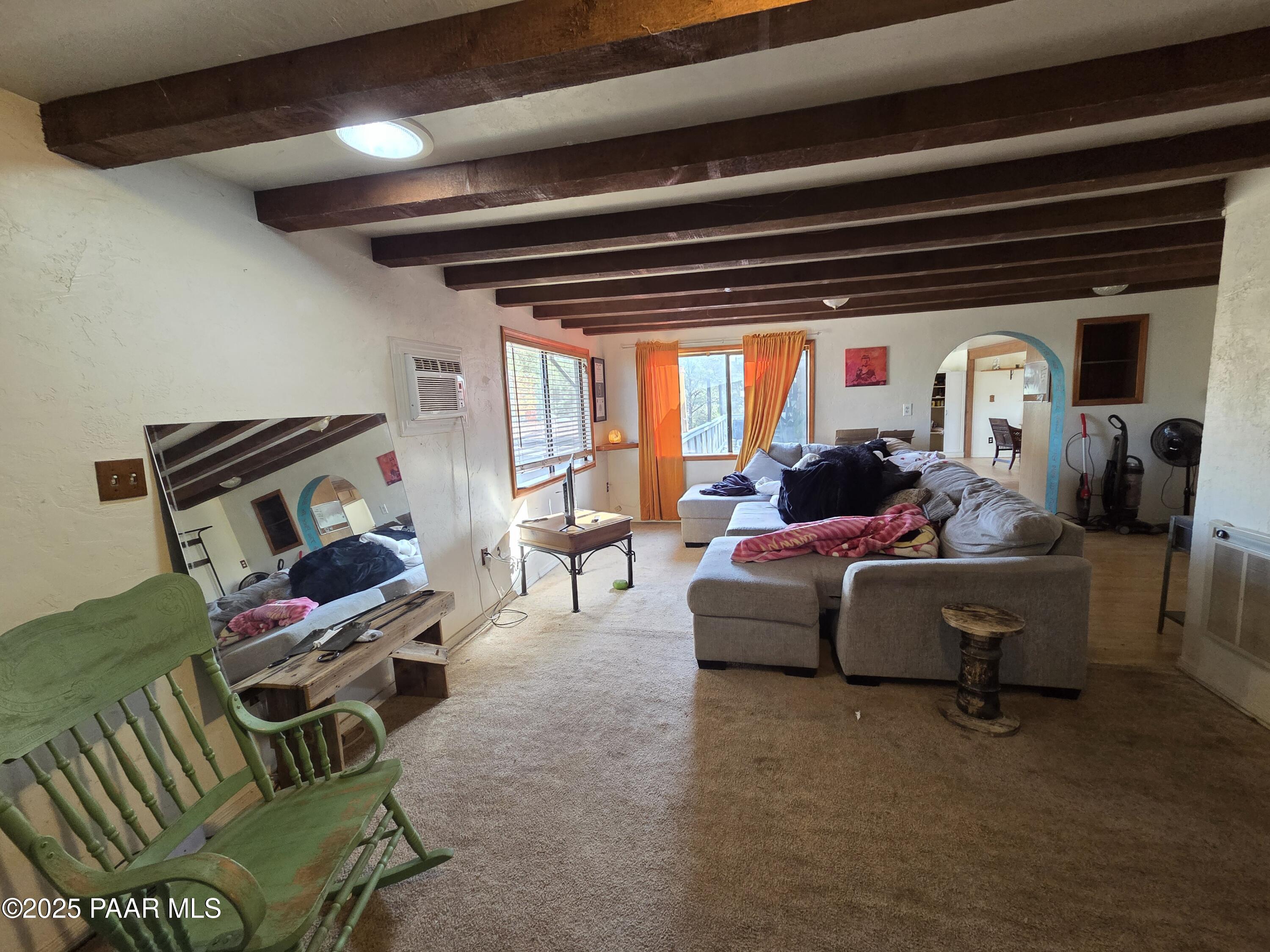 7250 West Hootenanny Road Prescott, AZ 86305 - Photo 22 of 30 a living room with furniture and a large window