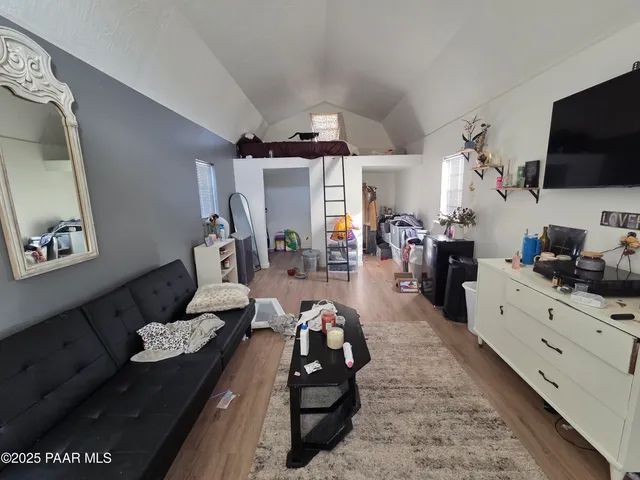 a view of a tree with a yard