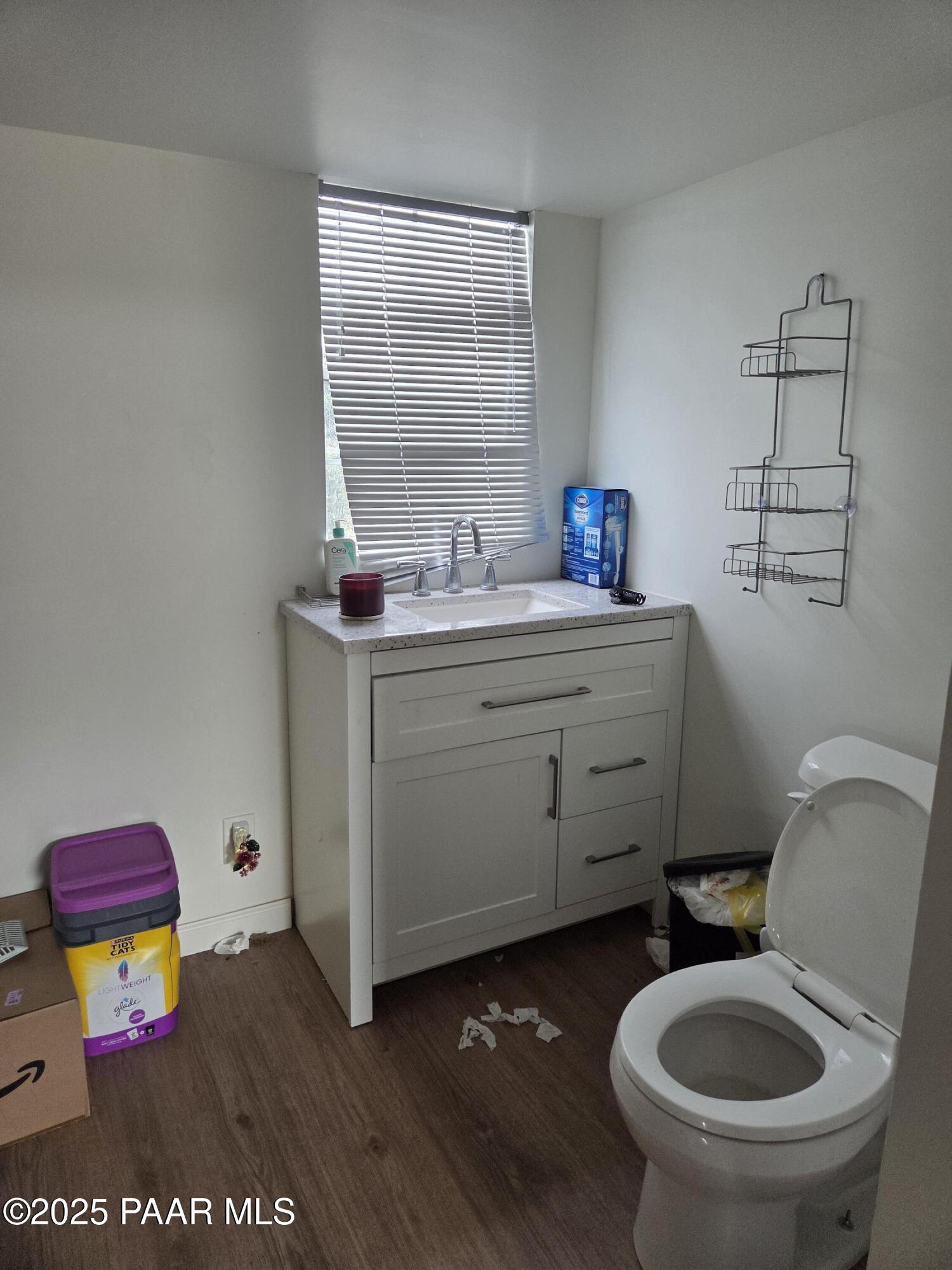 7250 West Hootenanny Road Prescott, AZ 86305 - Photo 30 of 30 a bathroom with a toilet sink and mirror