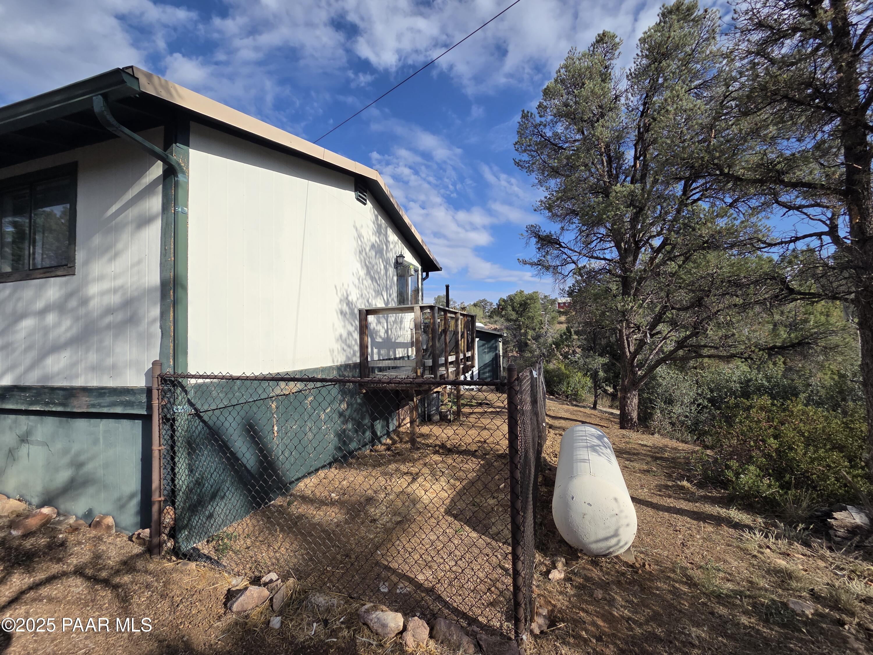 7250 West Hootenanny Road Prescott, AZ 86305 - Photo 4 of 30 a view of a back yard of the house