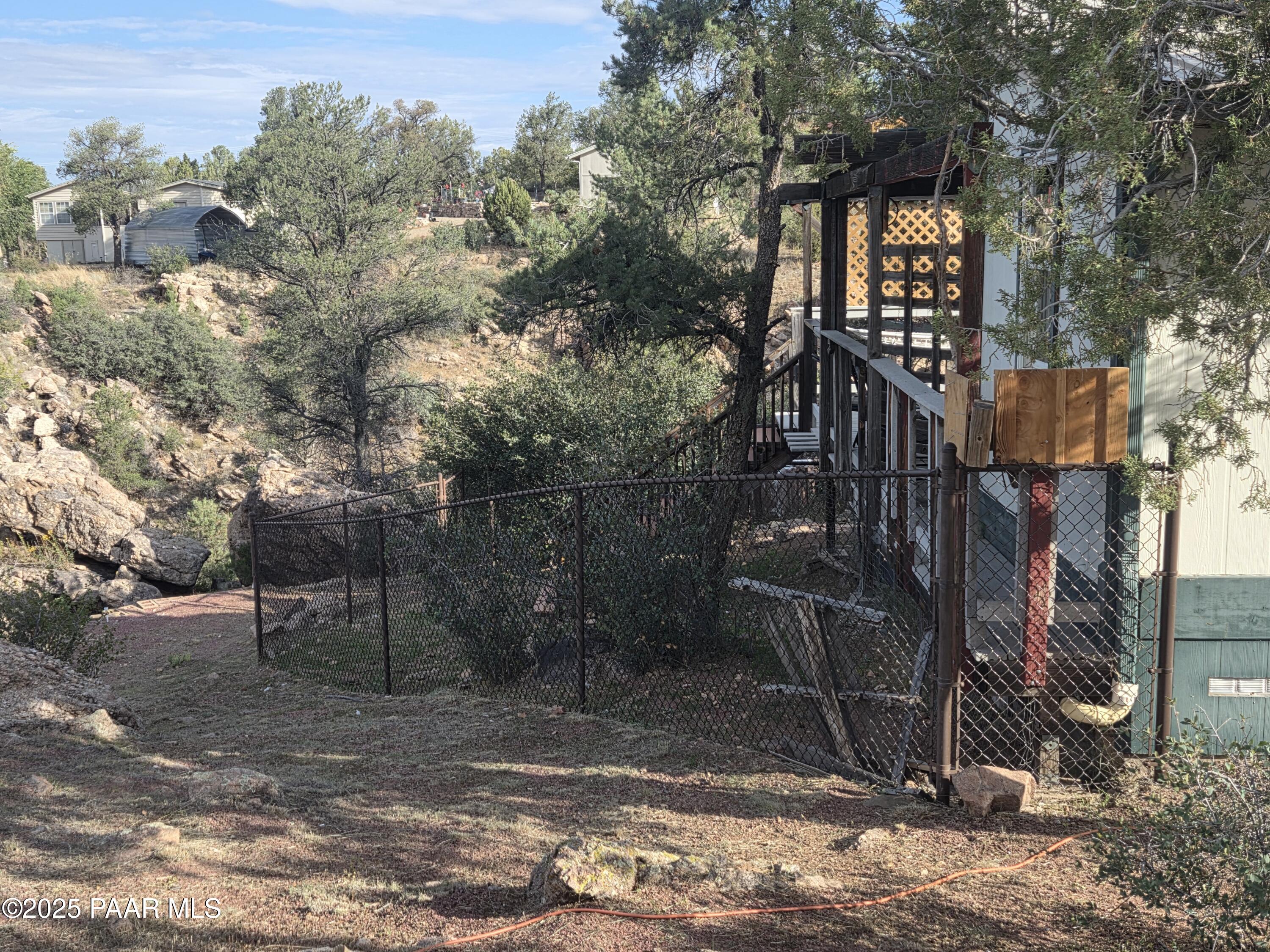 7250 West Hootenanny Road Prescott, AZ 86305 - Photo 6 of 30 a backyard of a house with lots of green space