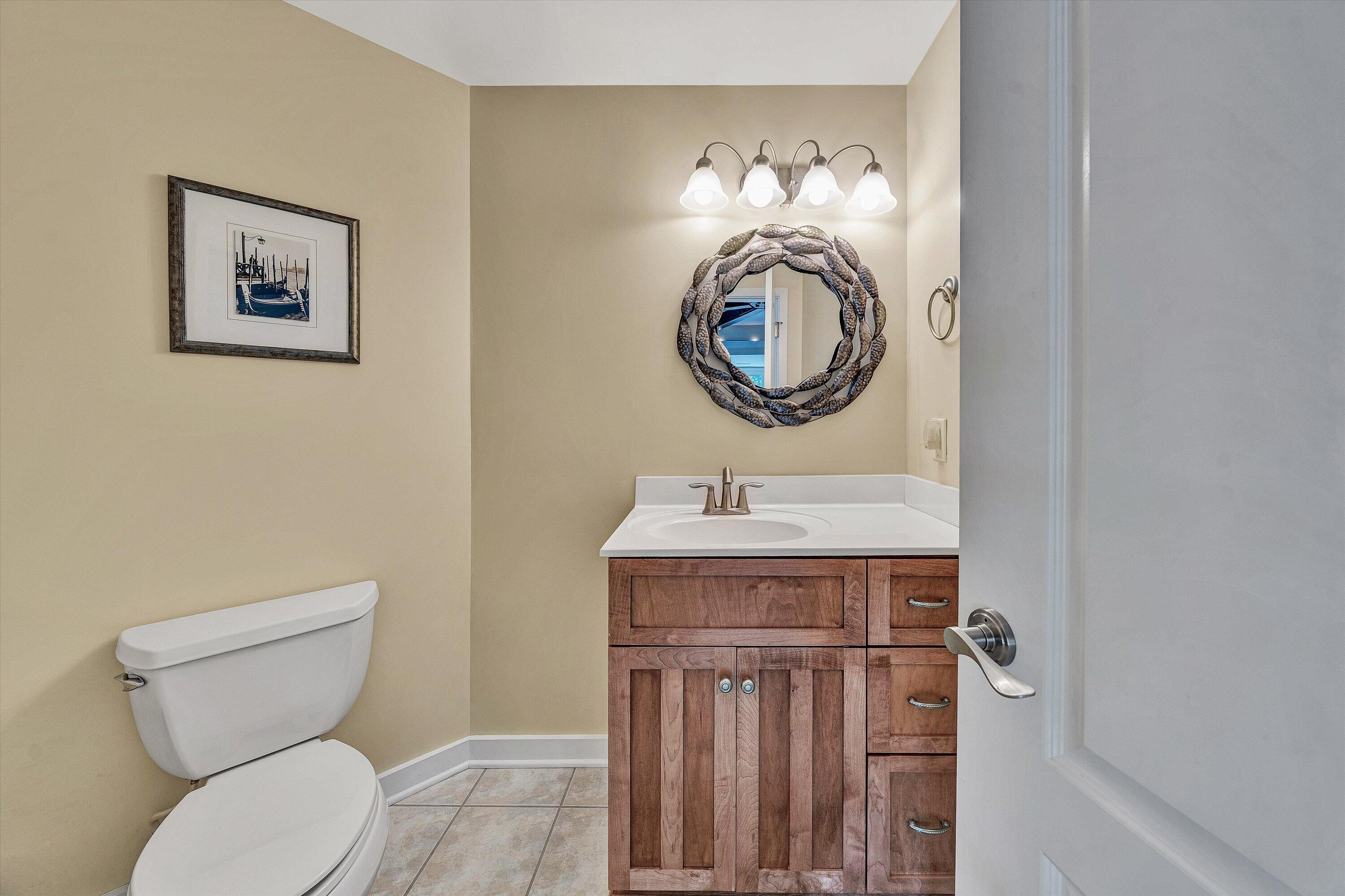 207 Winding Way Union Hall, VA 24176 - Photo 34 of 60 a bathroom with a toilet a sink and a mirror