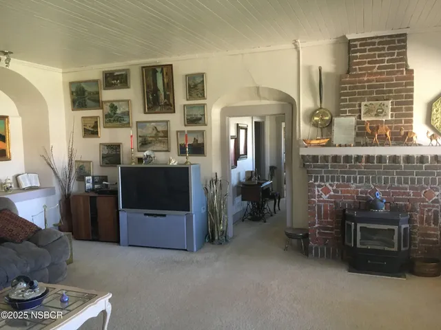 a bedroom with furniture and a fireplace