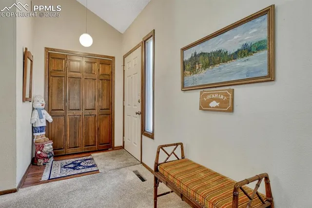a view of an entryway with wooden floor
