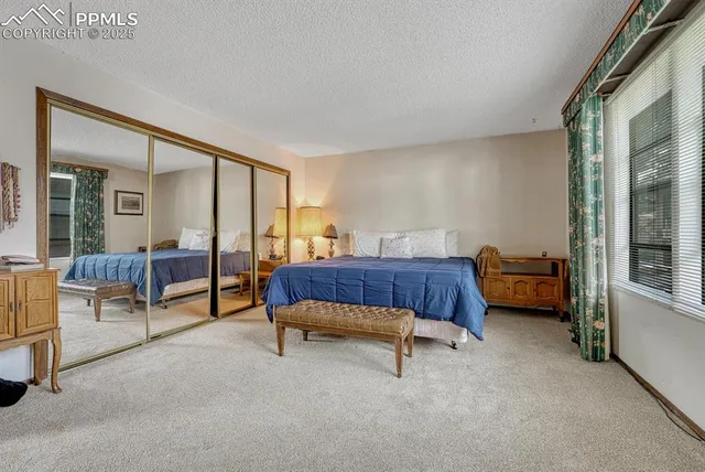 a bedroom with furniture and a window