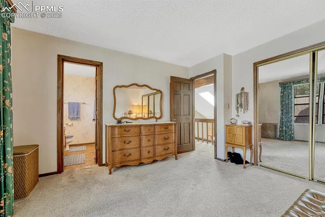 a room with a bed and a cabinets