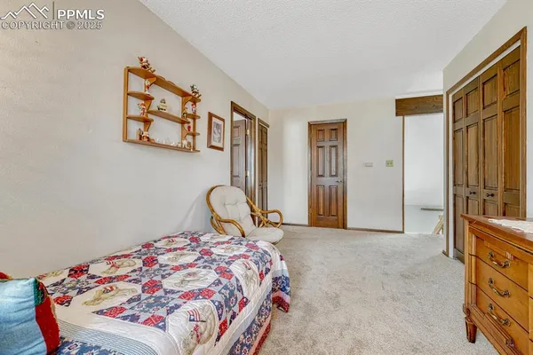 a bedroom with a bed and a cabinets