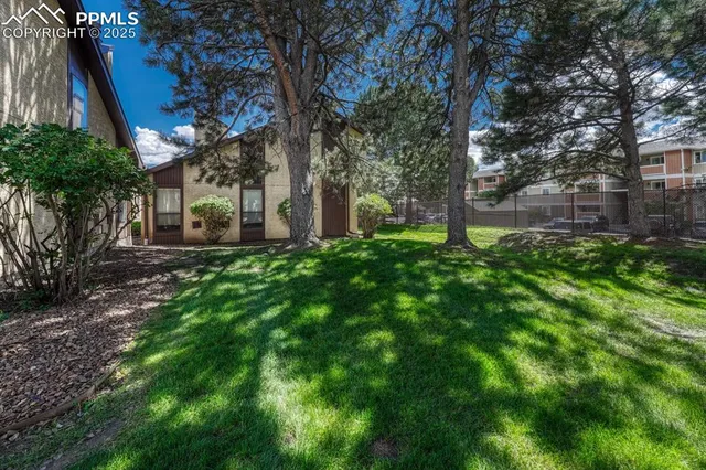 a backyard of a house with lots of green space