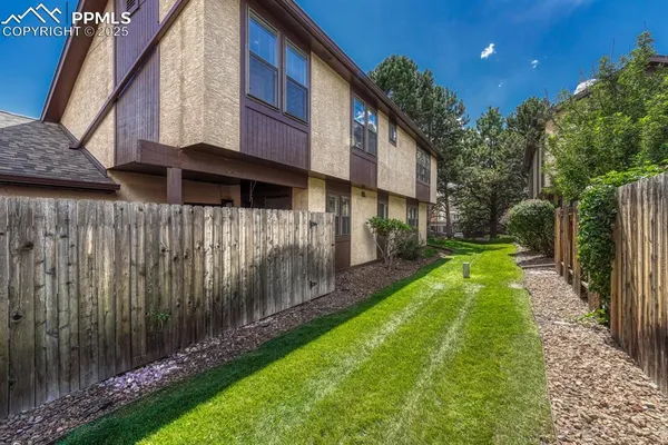 a view of a back yard of the house