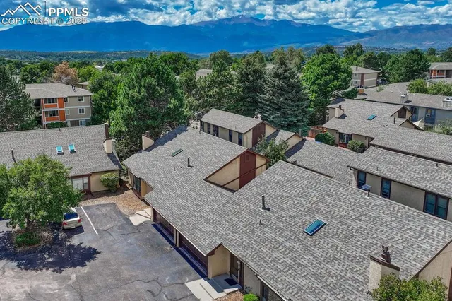 an aerial view of residential houses with outdoor space