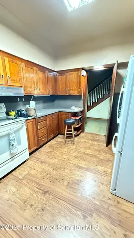 a view of a room with a hanging light