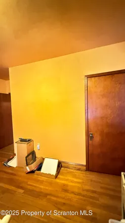 a view of a door with furniture and a window