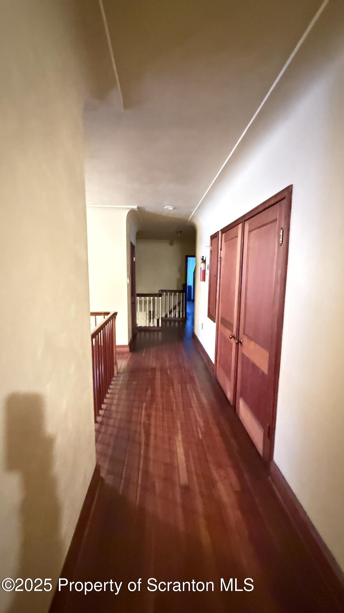 220 Hickory Ridge Road Carbondale, PA 18407 - Photo 35 of 51 a view of a hardwood floor in a hall with a window