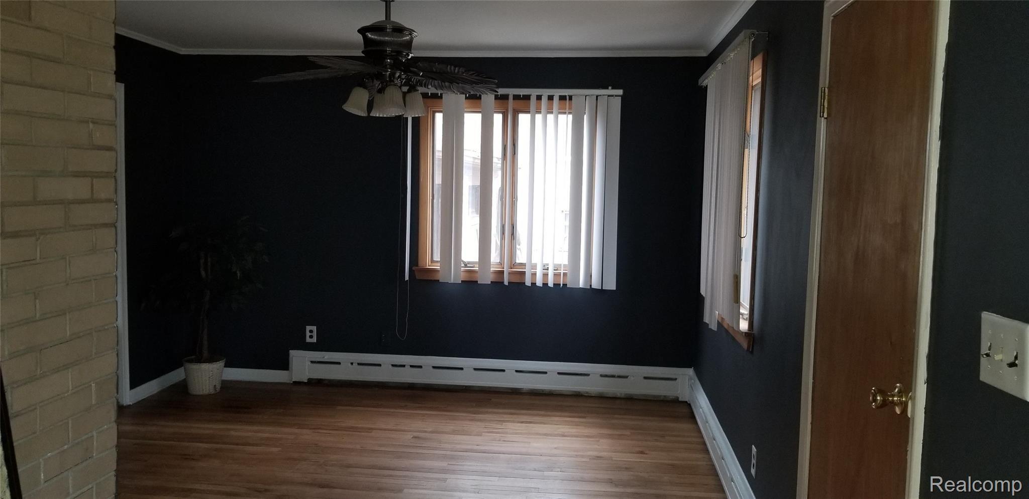 24105 Berg Road Southfield, MI 48033 - Photo 7 of 13 Full Size Dining Room with Hardwood Floors, Door to Deck and Multiple Windows