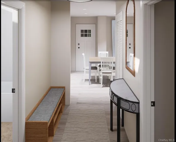 a view of a hallway with furniture and staircase