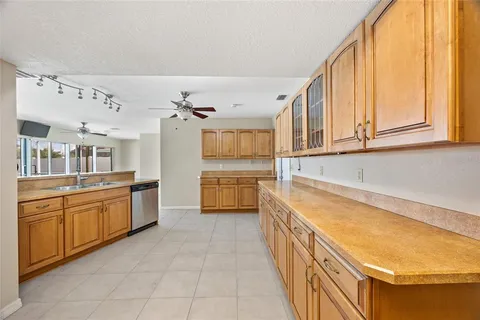 a kitchen with stainless steel appliances granite countertop a stove and a microwave