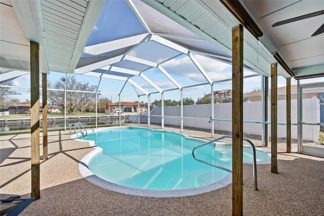 a backyard of a house with table and chairs