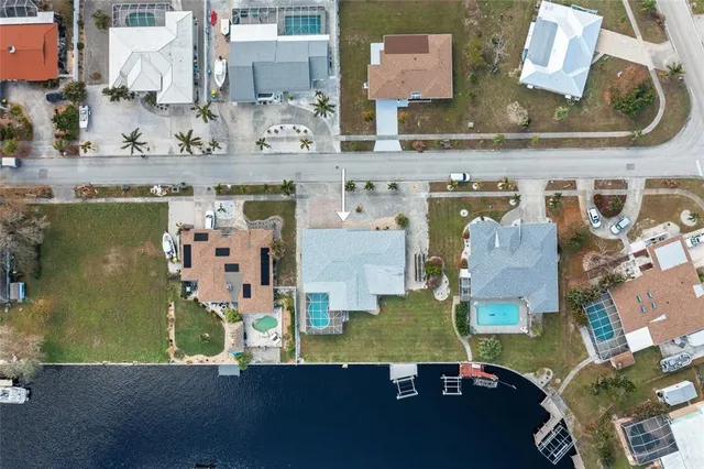 an aerial view of a house with a swimming pool