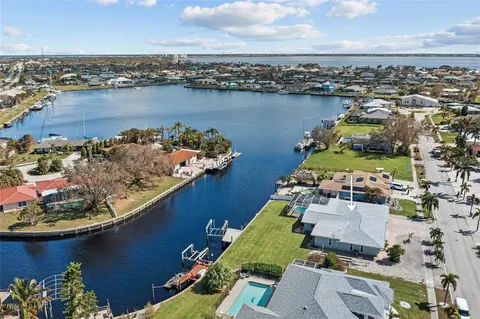 a view of a swimming pool with outdoor seating