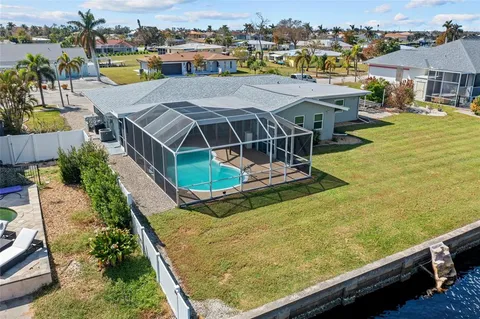 an aerial view of a house with a ocean view