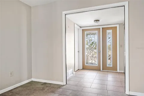 a view of livingroom with a ceiling fan and window